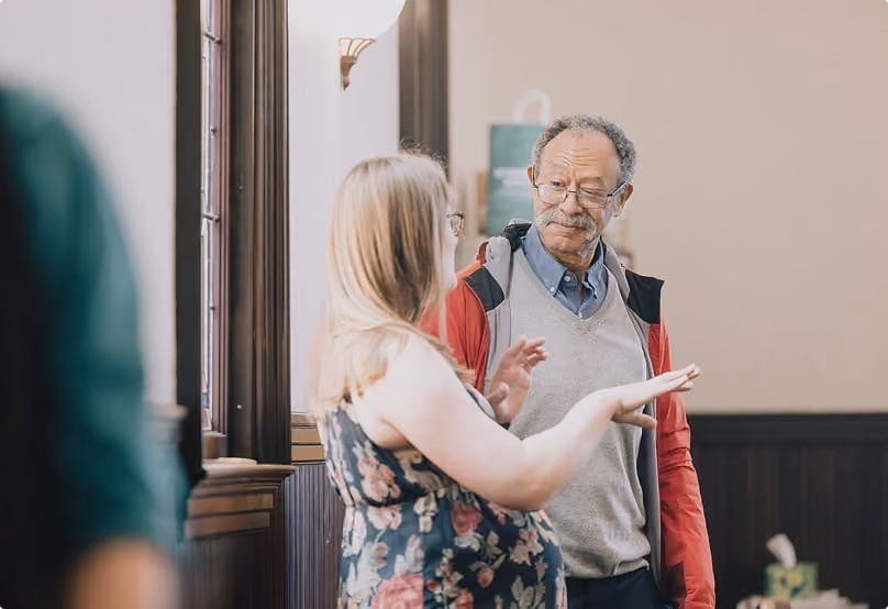 Two church members in conversation after the service