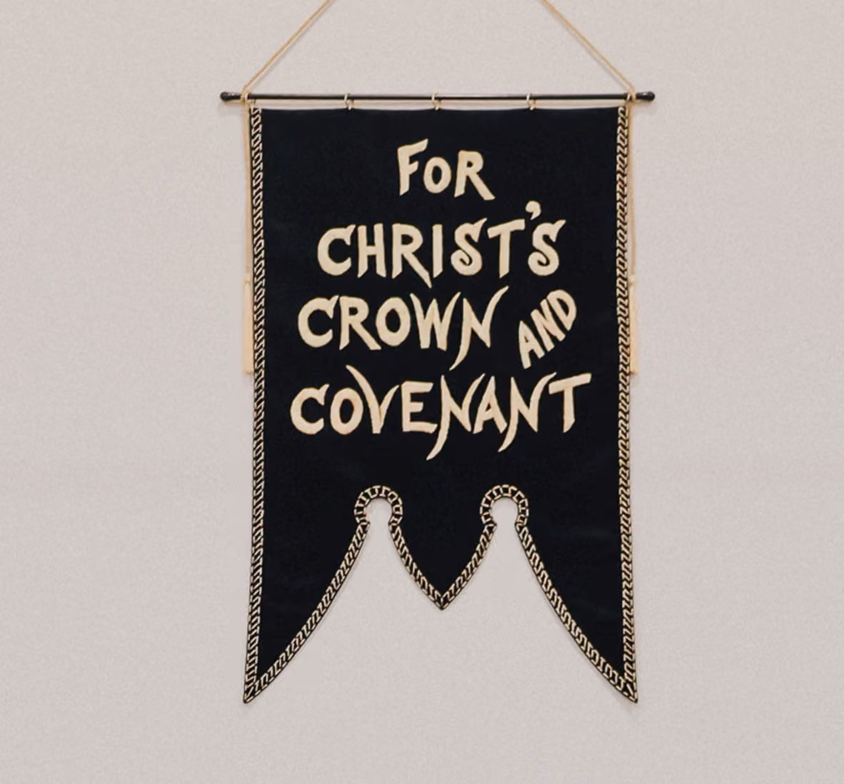 Embroidered banner reading “For Christ’s Crown and Covenant”