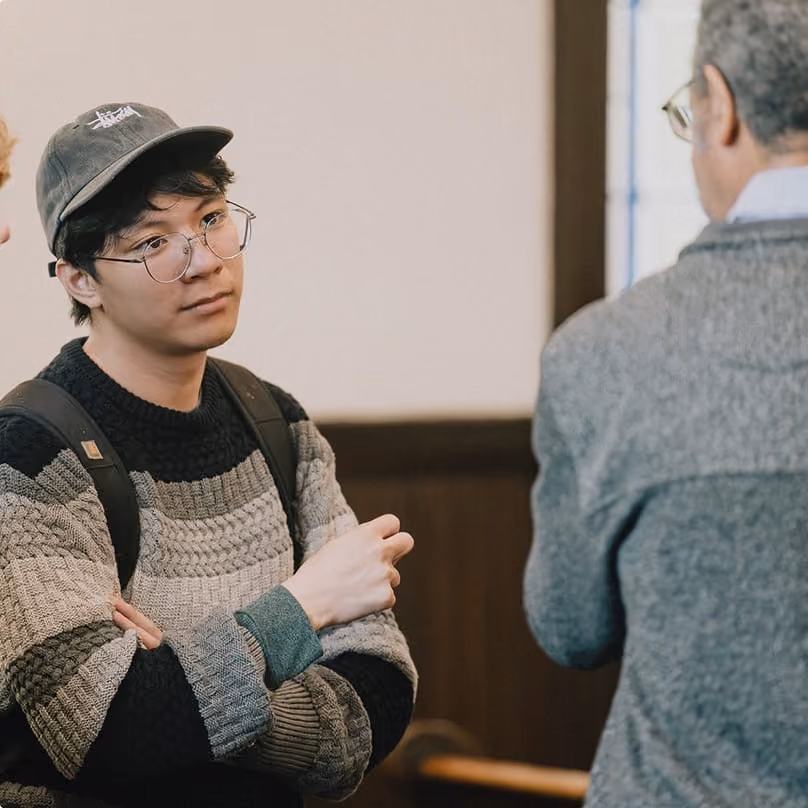 Two men in conversation during fellowship time