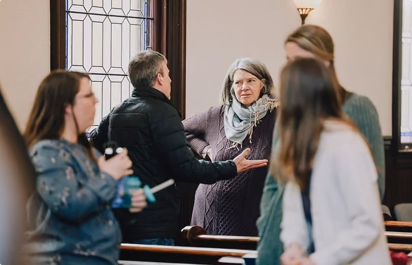 Members greeting one another during fellowship
