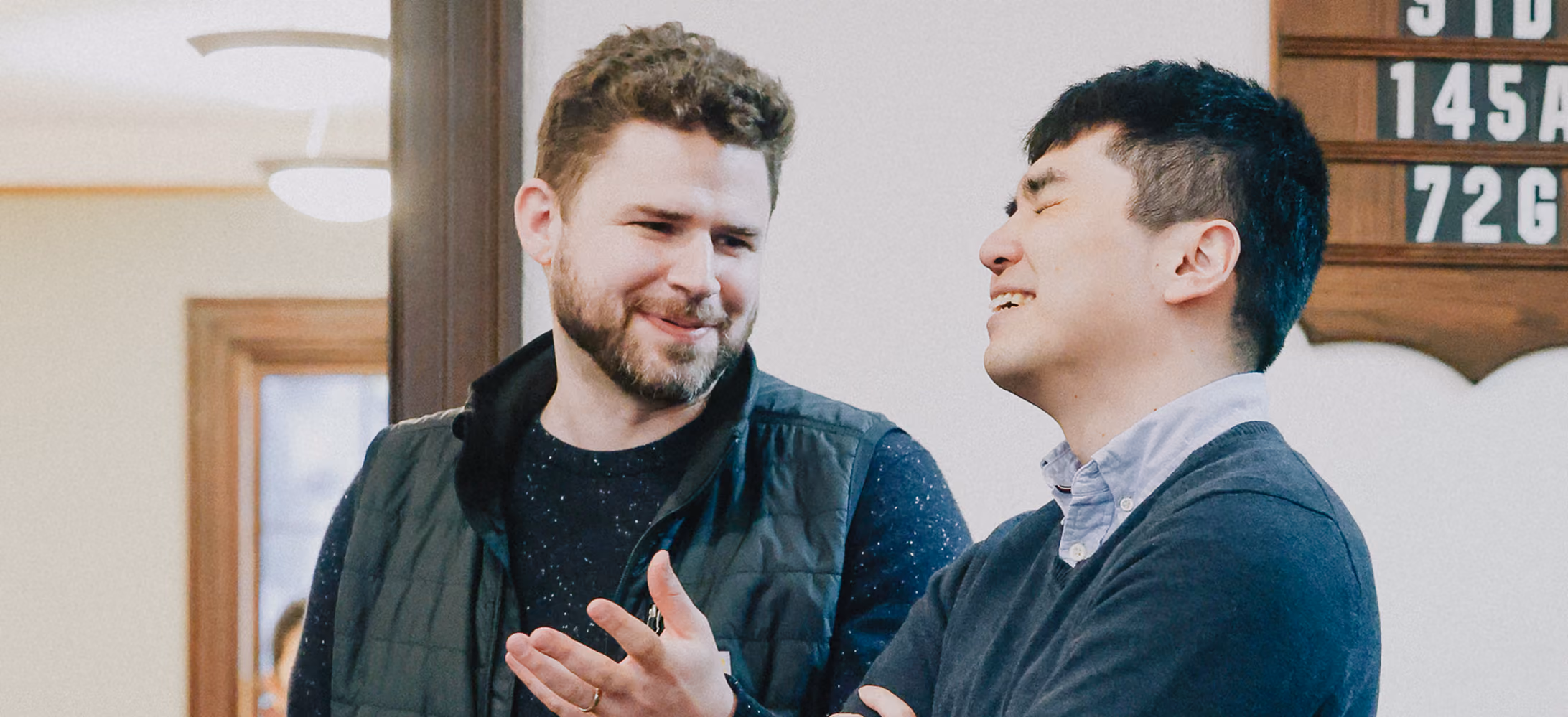 Two church members smiling in conversation